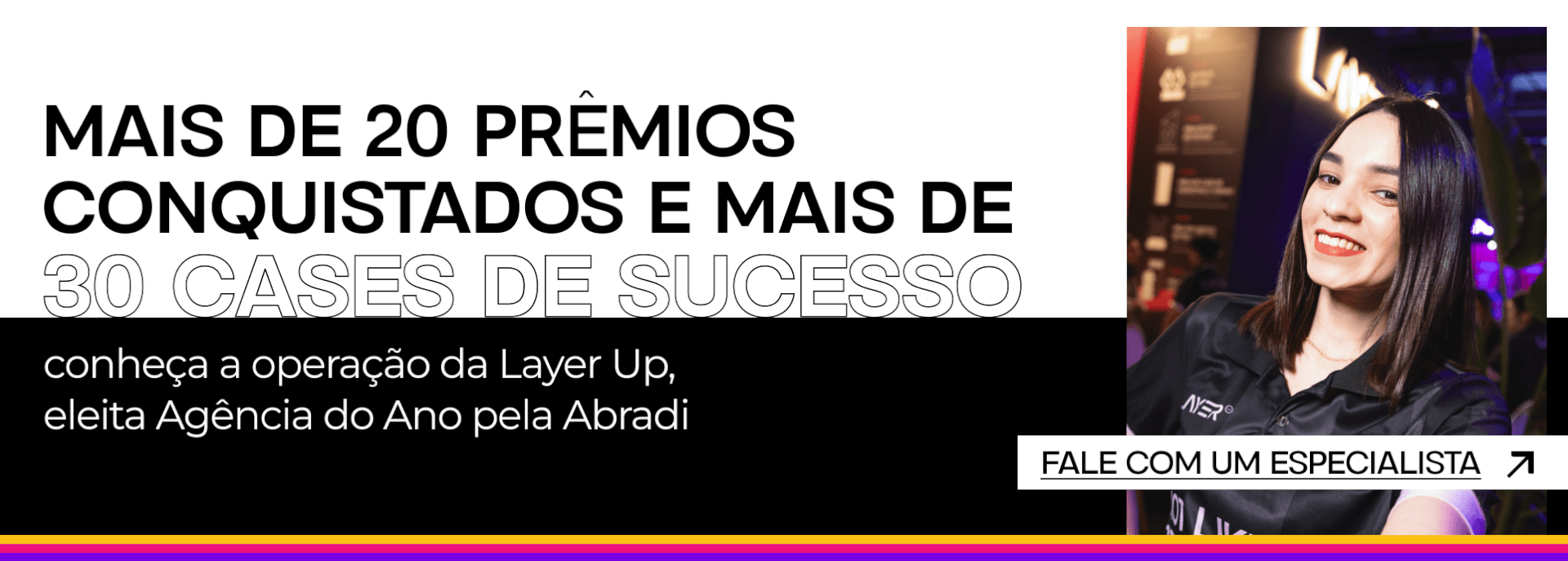 Banner da agência Layer Up destacando prêmios, cases de sucesso e o título de Agência do Ano pela Abradi. À direita, imagem de uma colaboradora sorrindo e botão para falar com um especialista.